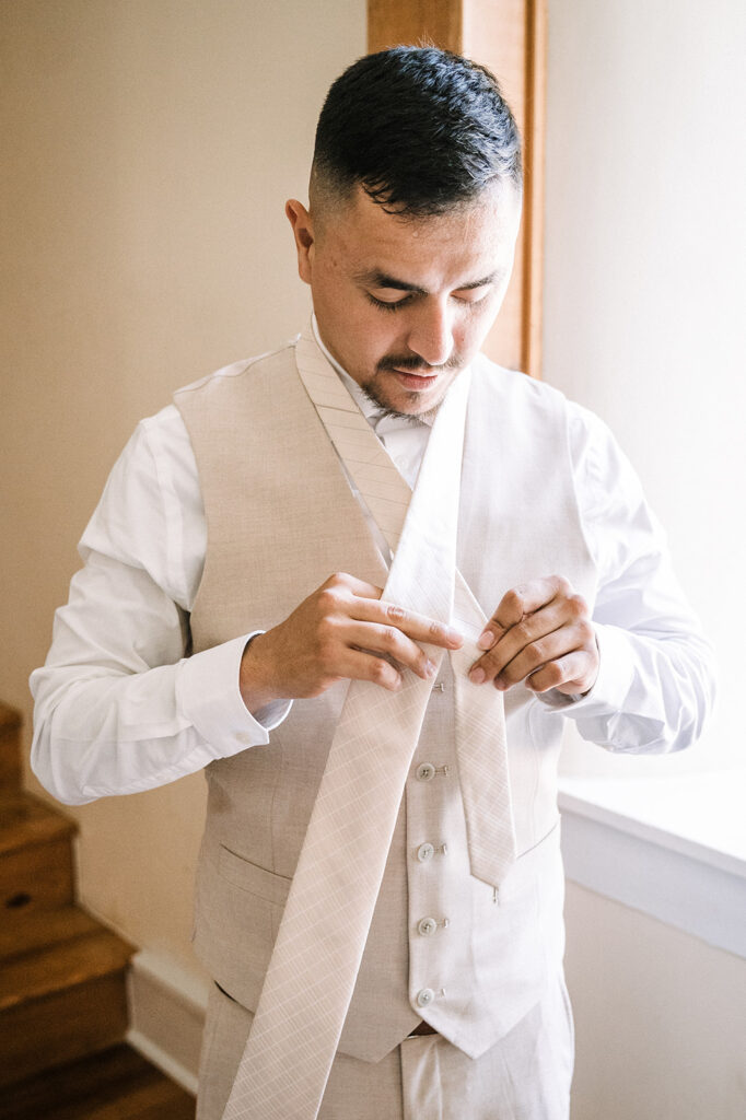 Groom getting ready on wedding morning at Gordon Springs Wedding Venue