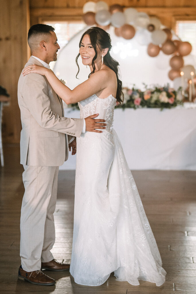 Bride and groom first dance during wedding reception