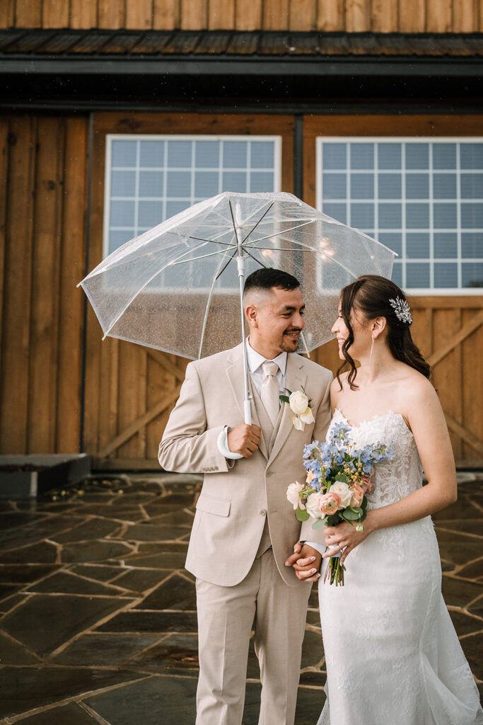 bride and groom portraits with umbrella