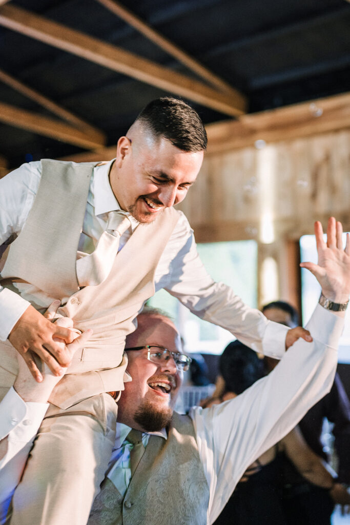 Groom dancing and having fun with guests